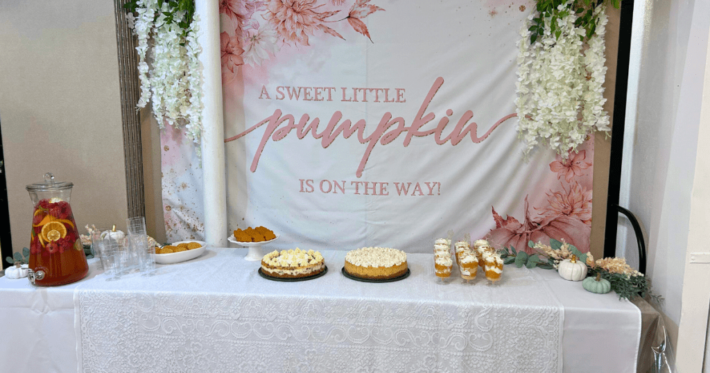 baby shower pumpkin theme set up with desserts