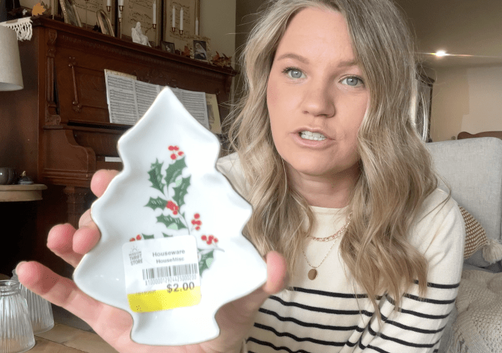 blond woman holding a small christmas tree shaped tray in her hand showing it to the camera